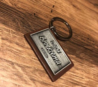 Leather keychain with a custom metal plate 