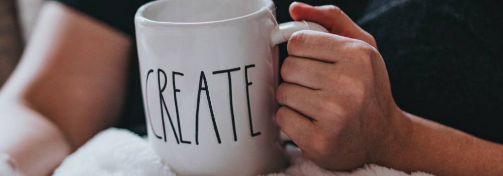 A mug with the word 'Create', representing creative Christian content.