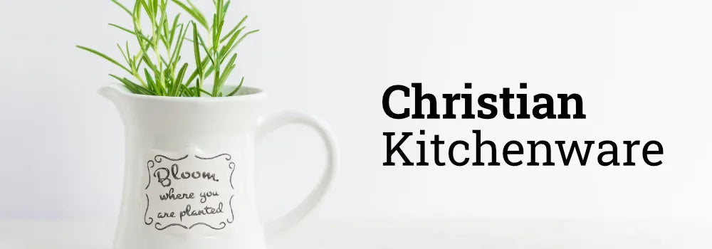 A vase with green leaves inside and encouraging words printed onto it, representing Christian kitchenware.