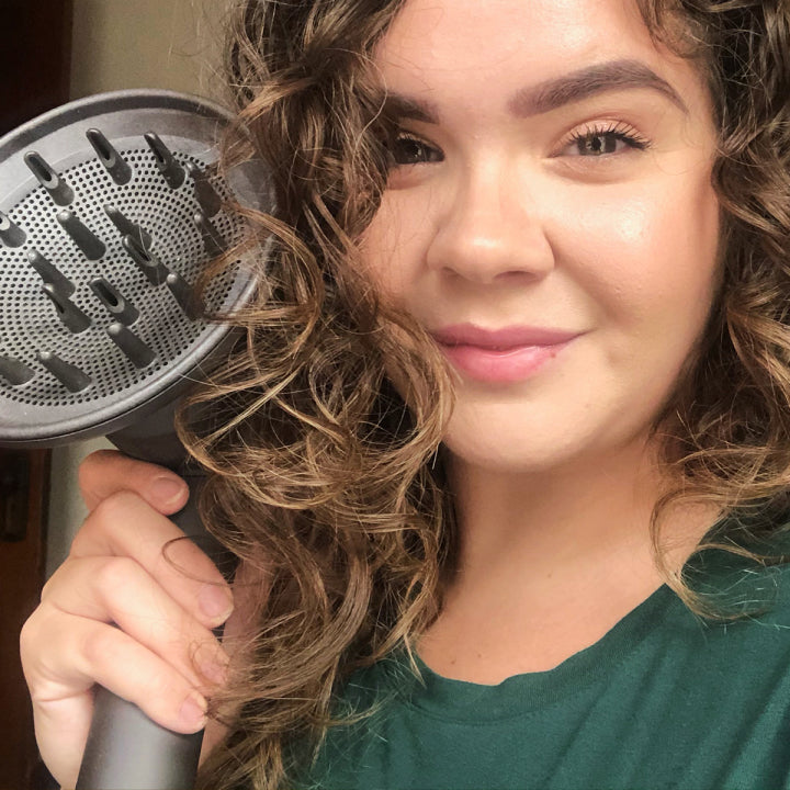 woman holding a hair diffuser