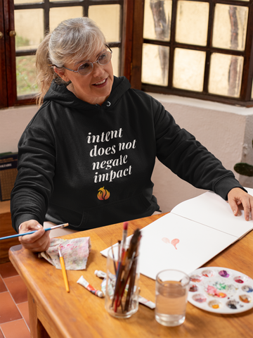 Person wearing Phoenix Ash Apparel while engaging in a creative activity