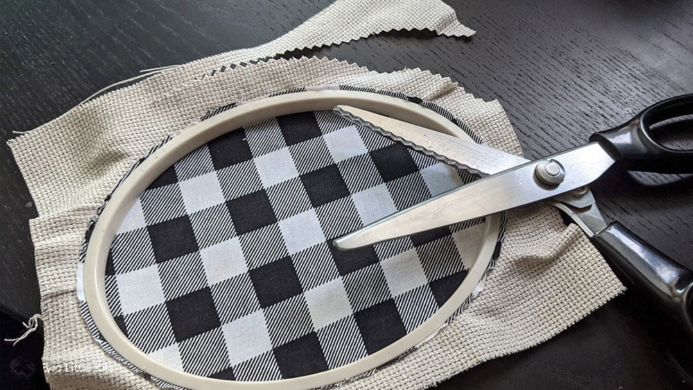 Pinking shears demonstrating cutting around the edge of the Aida fabric