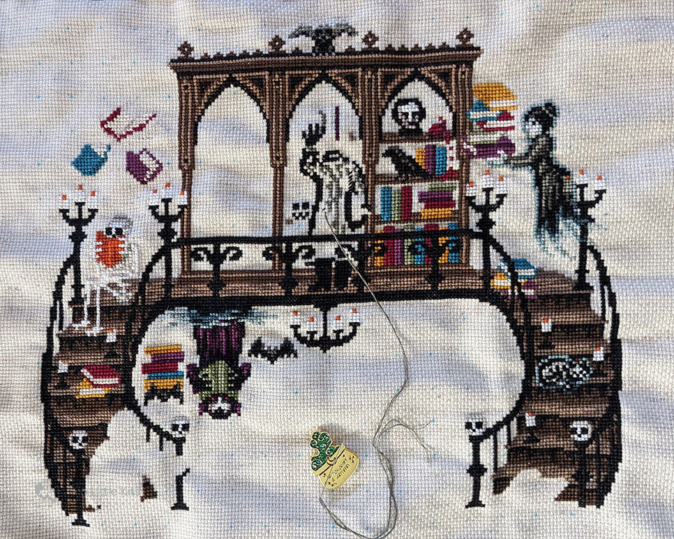 My end-of-month progress shot of the stitch-along, "The Haunted Library"