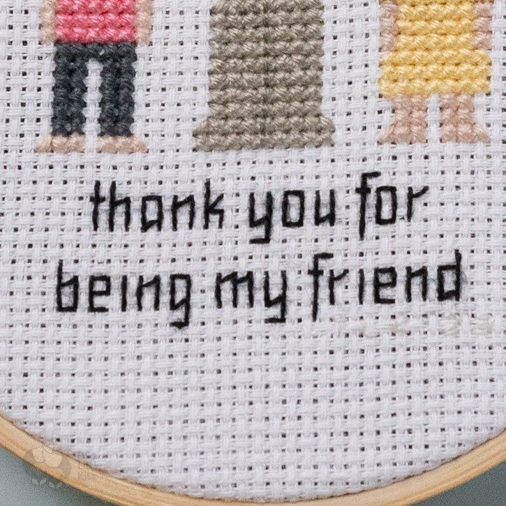 Close-up photograph of the above stitched piece, specifically the wording that reads "Thank you for being my friend".