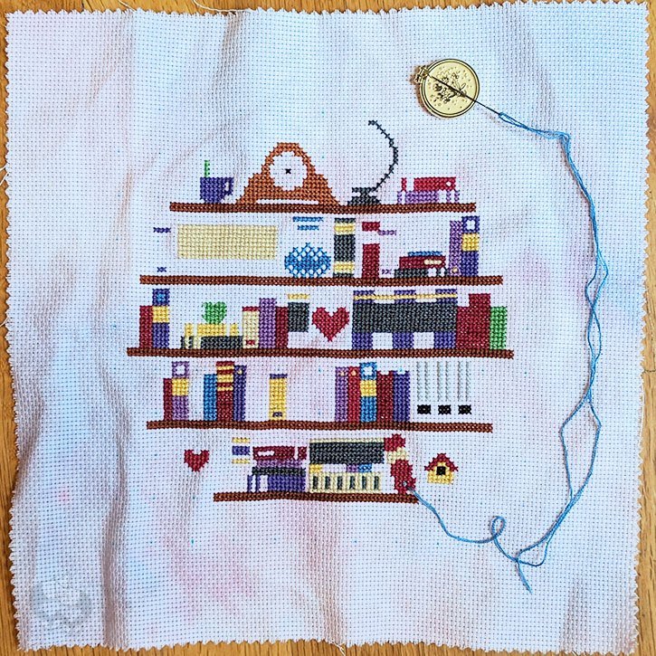 Work-in-progress of "Book Lover's Shelf" cross-stitch pattern