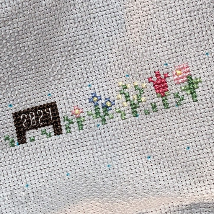 The beginning stitches of my "flower field" piece.