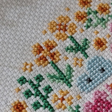 Close-up photograph of the completed cross-stitch