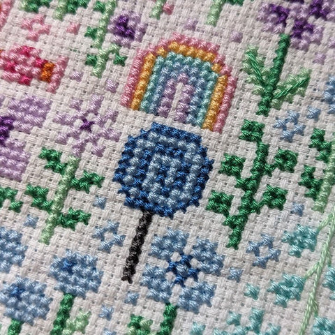 Close-up photograph of the completed cross-stitch