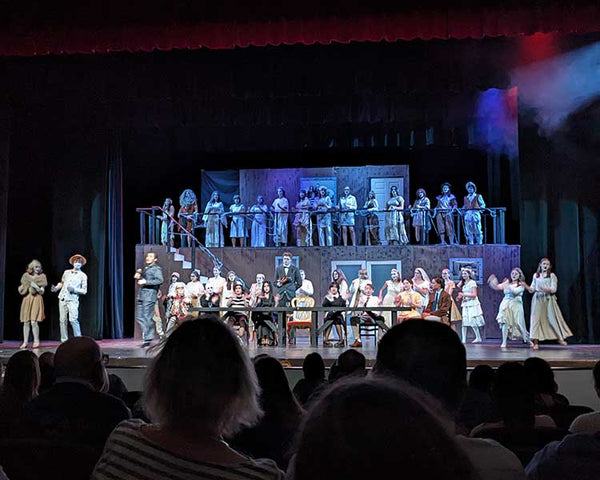 A photo of a high school play of 'The Addams Family' 