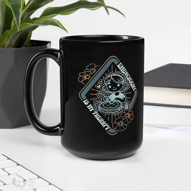 A mock-up of a glossy, black, ceramic mug that has the "My Therapy" design printed on it