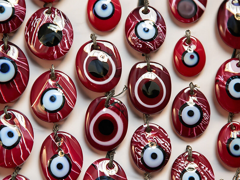 A collection of maroon evil eye accessories