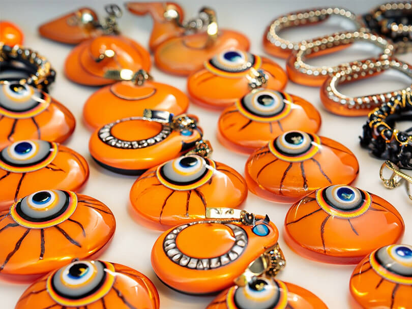 Assortment of Orange Evil Eye Jewelry Pieces