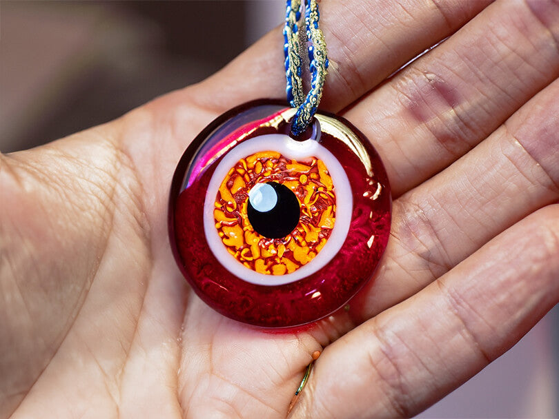 Close-up of a Maroon Evil Eye Amulet