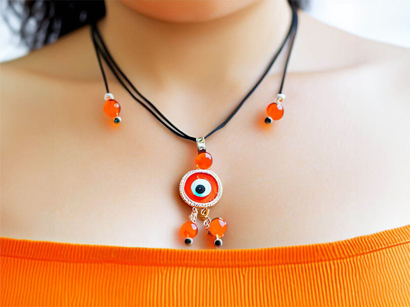 Person Wearing Orange Evil Eye Jewelry