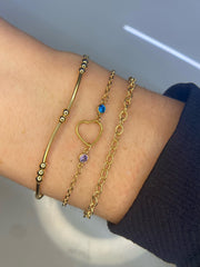 permanent jewelry bracelet with heart and birthstones