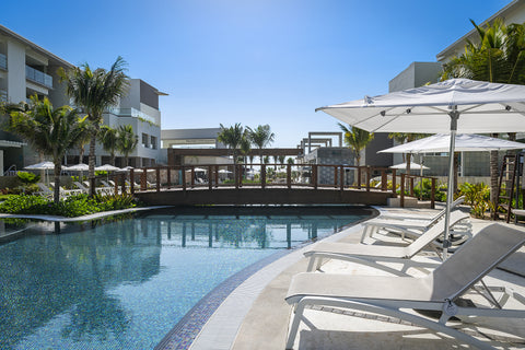 sunbathing-sunset-pool-side