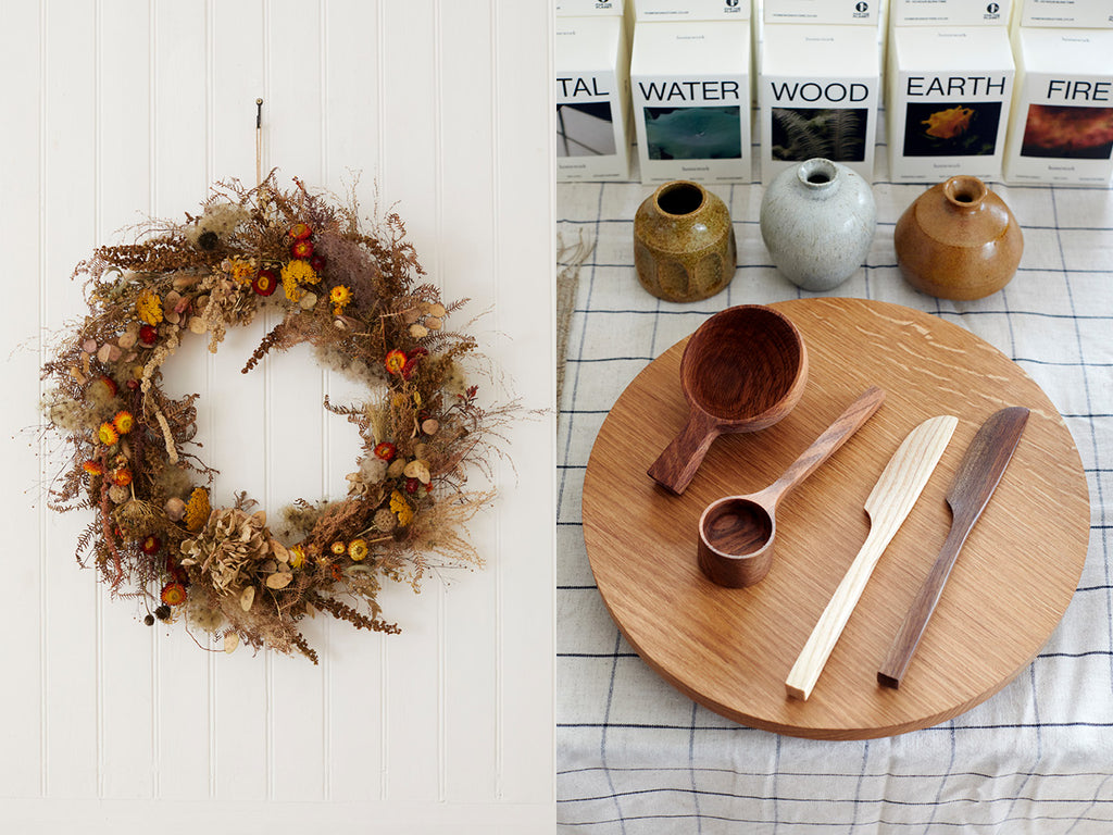 A dried flower wreath, wooden tableware, bud vases and scented candles at the Land Tales pop up shop