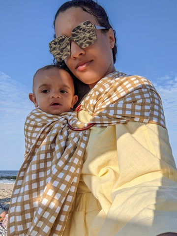 Immy, mom of two rocking the sold out Gingham Sling style from Chekoh Baby Carriers
