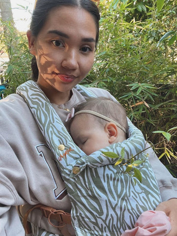 Chekoh Mama, Yvette, loves wearing her Clip Carrier to keep her little babe close.