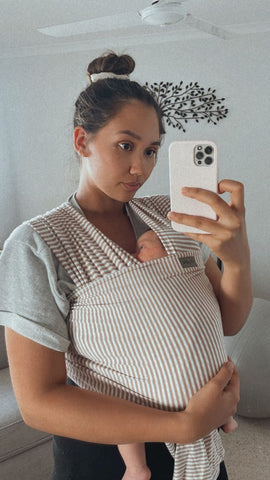 Yvette Dawson wears the Chekoh Baby Stretchy Wrap perfect for newborns