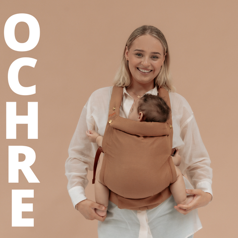 Laney wearing the new Ochre Clip Carrier by Chekoh Baby 