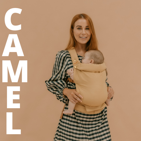 Chelsea wearing the Camel Clip Carrier by Chekoh Baby