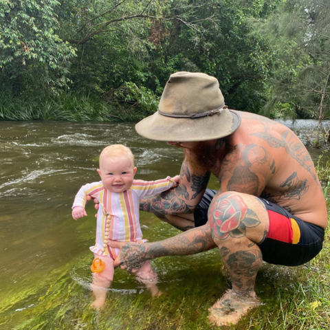 Tim and Baby Zuri down at their local swimming hole