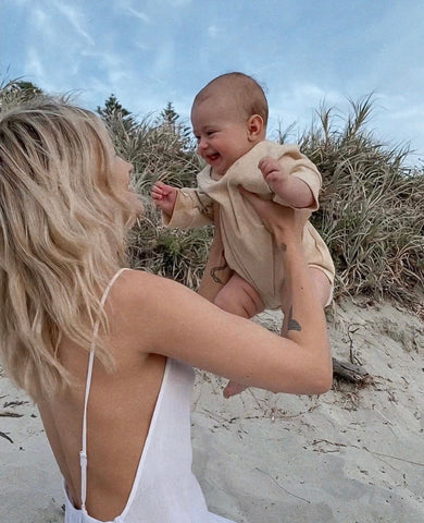 Mady Lee and daughter Indi-Rose loving, laughing on a beach. @madylee__