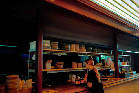 Hallertau, Riverhead waiter waits at the kitchen counter, Lil Ceramics plates piled high