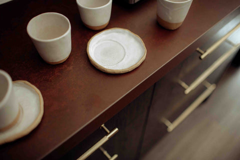 Custom hand shaped Lil Ceramics Coffee tumblers and saucers at Kol, Ponsonby