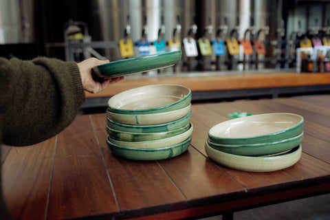 Lil Ceramics plate stack in front of Hallertau, Riverhead beer pouring taps