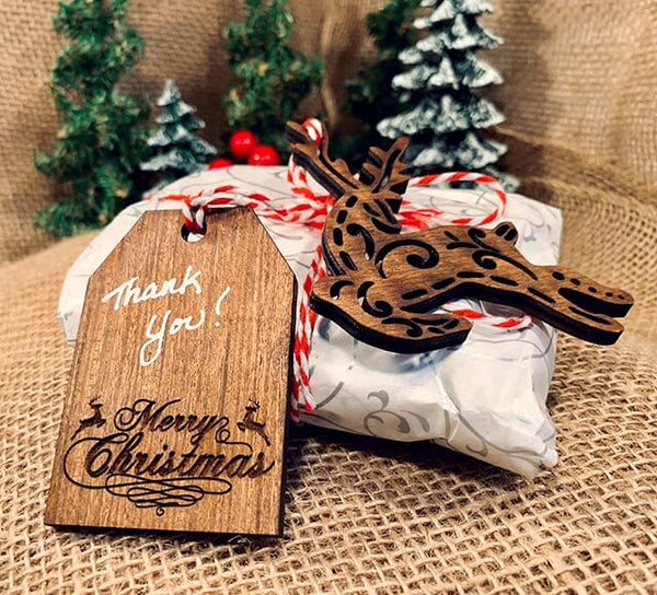 A Christmas gift with "Thank You" tag and wooden reindeer