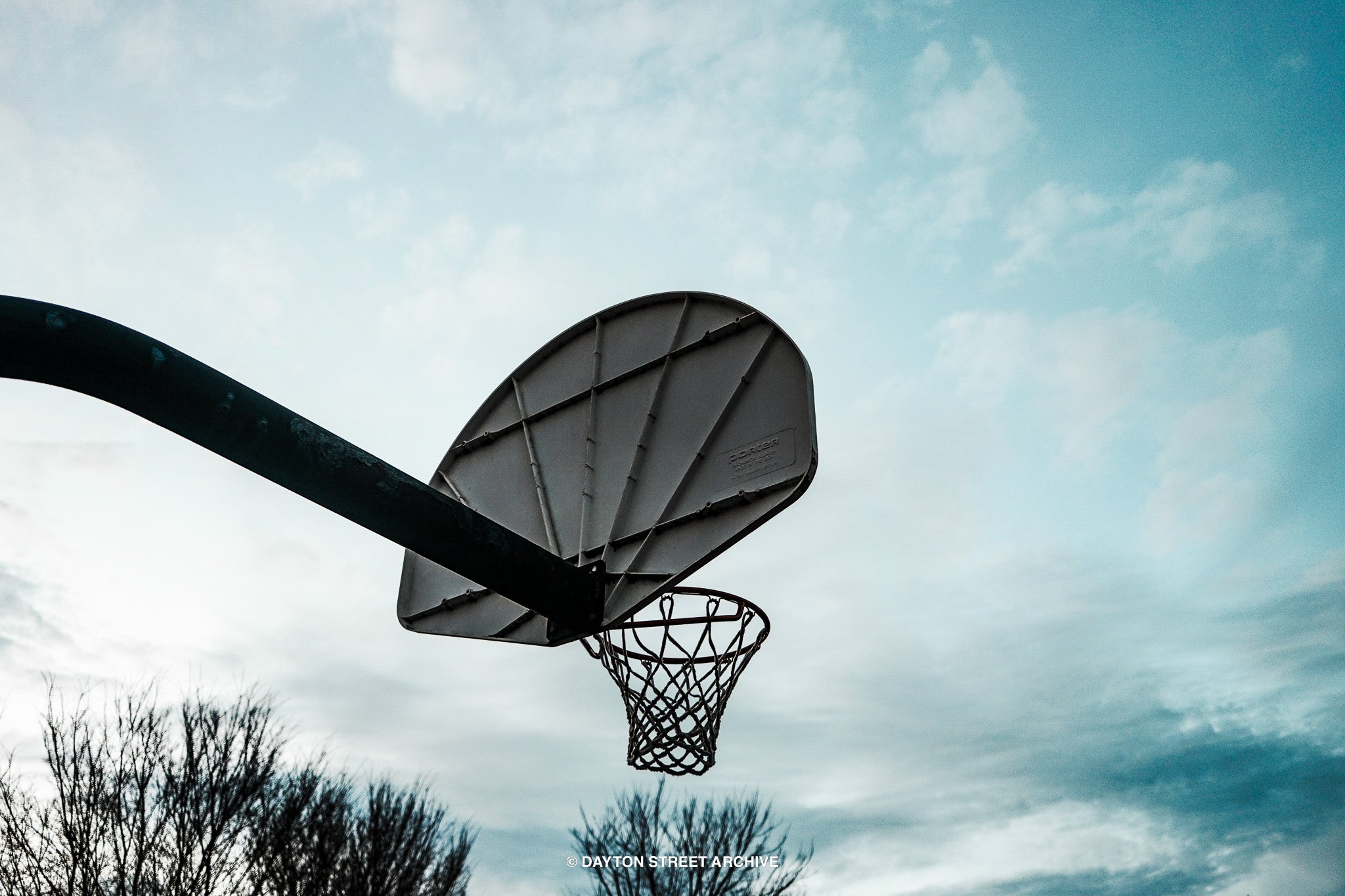 basketball hoop with winter blue sky