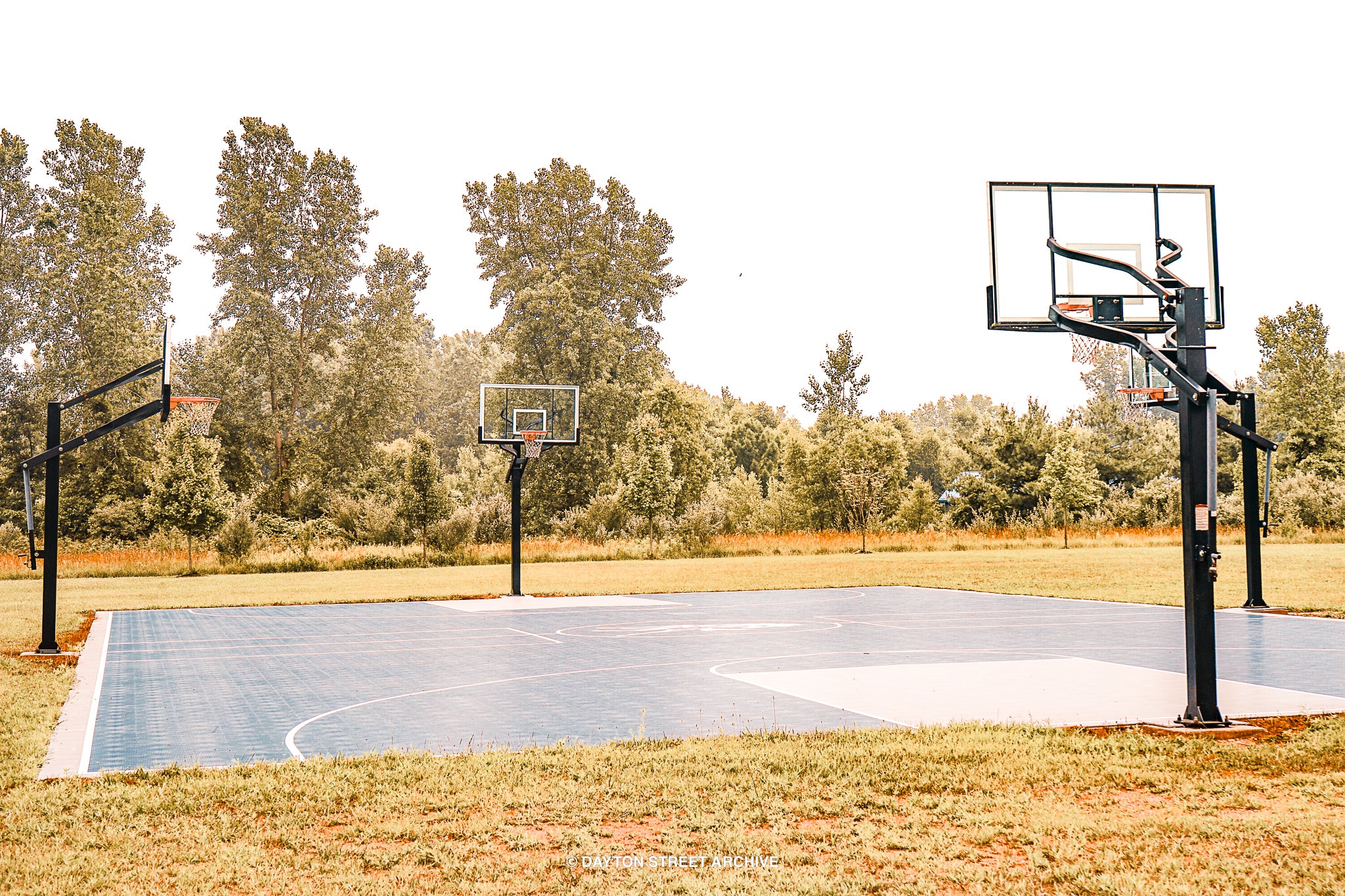 Photograph of dreamy basketball court with golden grass in Michigan
