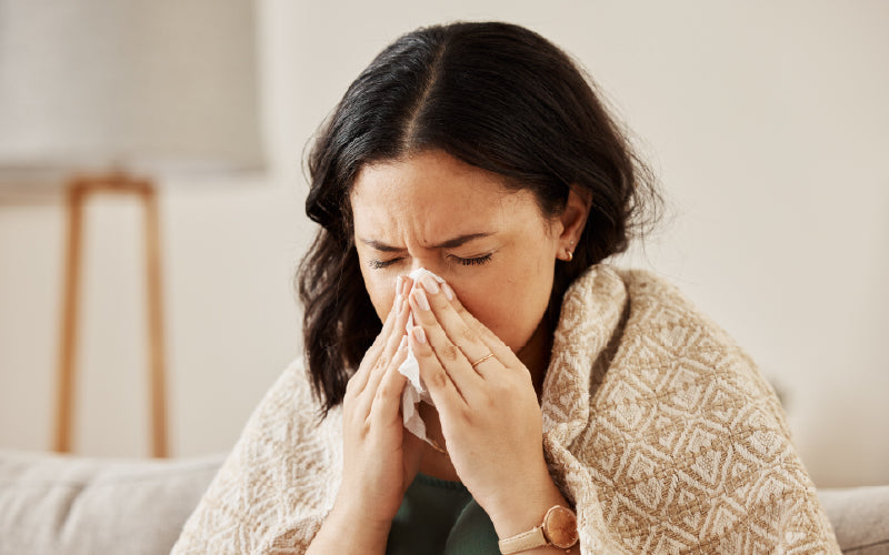 An allergy sufferer sneezing