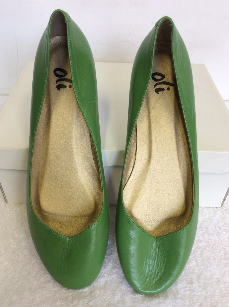 green leather pumps