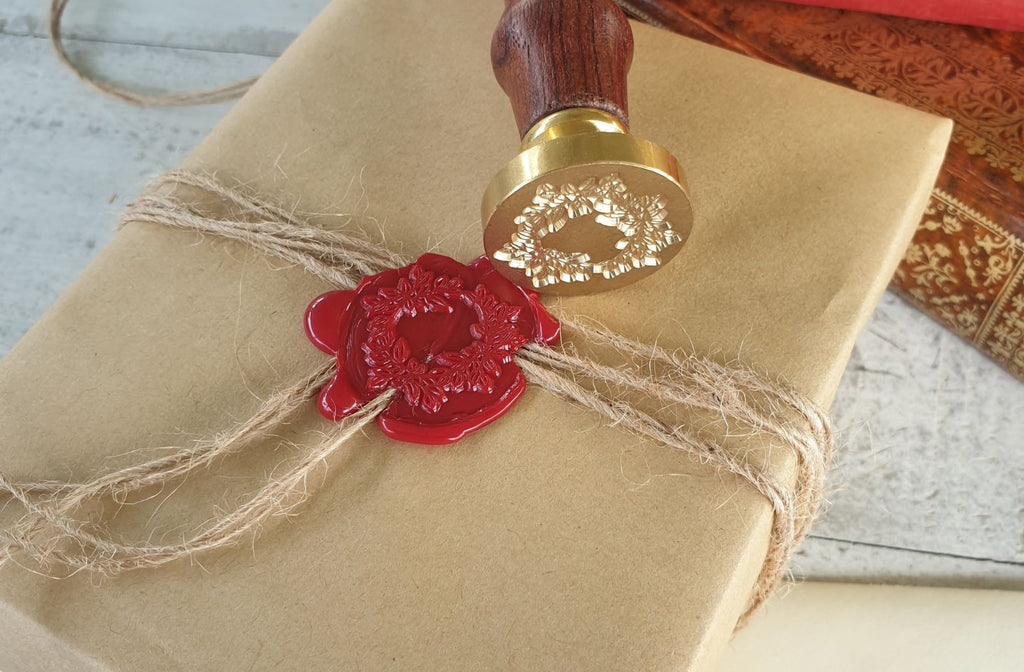 red wax seal on brown paper package