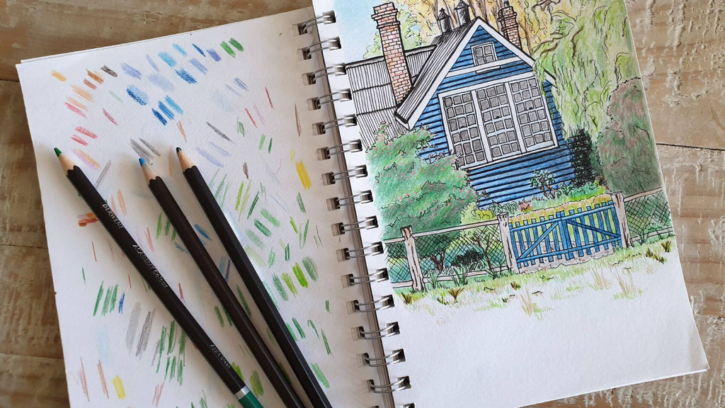 art journal with colour pencil sketch of house