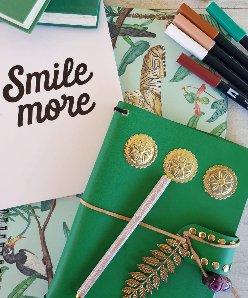 Green leather journal cover and pink smile more notebook