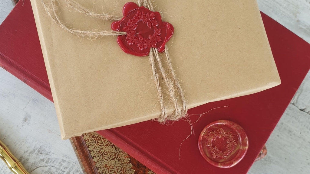 Brown paper gift wrap with red wax seal