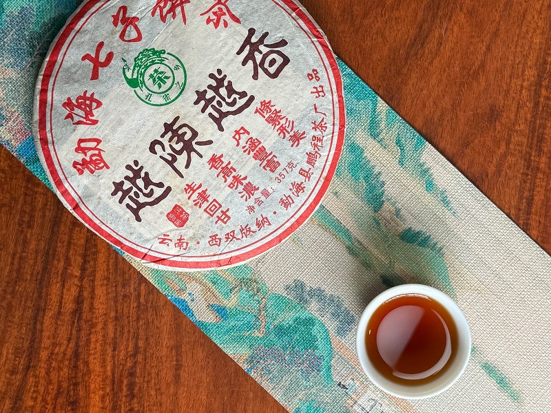Ripe Pu-erh tea cake and tea liquor