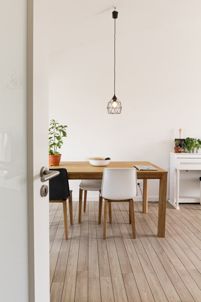 Modern white dining room with hardwood floors