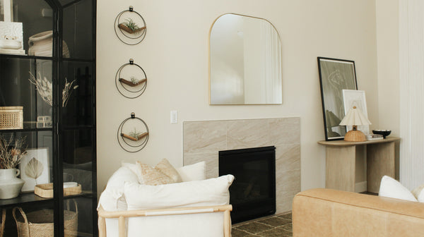 A trio of braid & wood v-hangers styled in modern livingroom