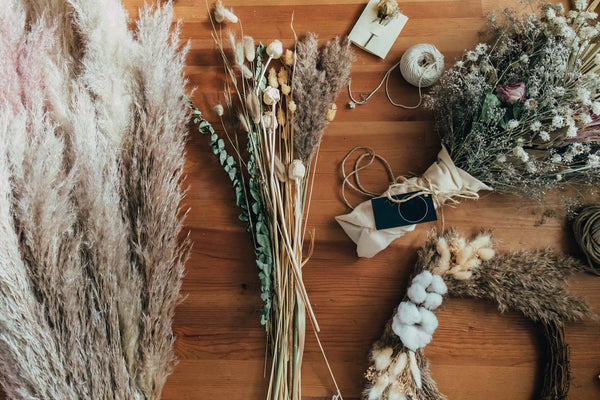 dried florals on dark wood table