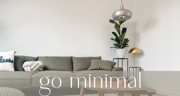 minimal living room with couch and fiddle leaf fig houseplant