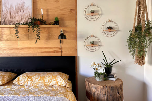 Braid & Wood Plant Shelves styled next to bed in primary bedroom