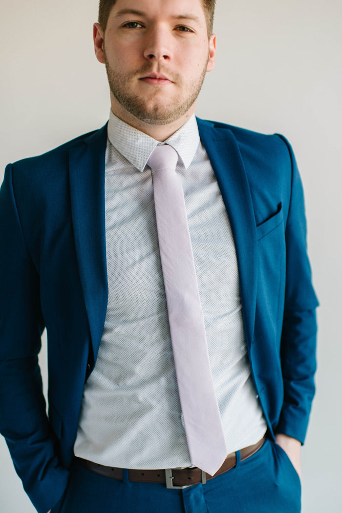 blue suit white shirt purple tie