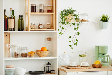 Open shelves in a kitchen displaying a variety of wooden accessories.