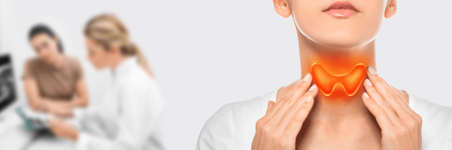 Woman touching her own neck, thyroid highlighted in red