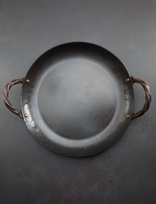 https://cdn.shopify.com/s/files/1/0735/1749/8643/files/cookware-stage-coach-farm-forge-oregon-13-copper-carbon-steel-roasting-pan-43219644154131.jpg?v=1694472664&width=500